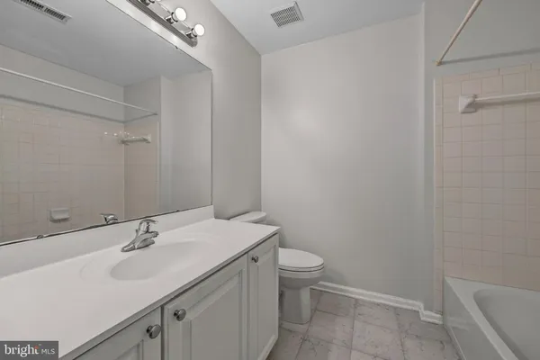 a bathroom with a sink toilet and vanity