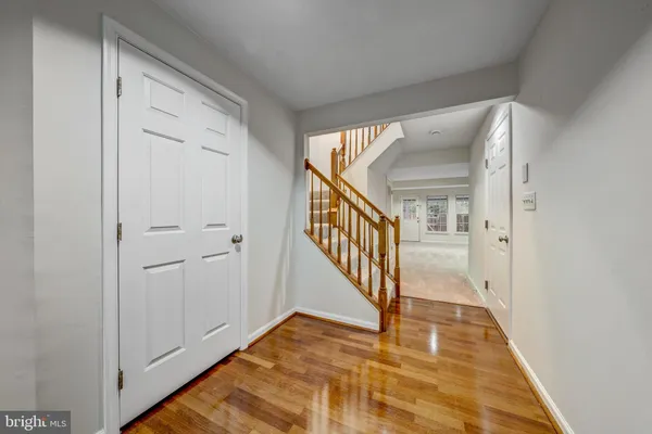 a view of backyard with deck and wooden floor