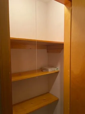a view of a hallway to a bedroom