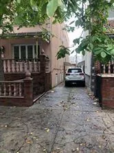 a view of a car park in front of a house
