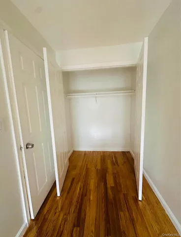 a view of a room with wooden floor and staircase