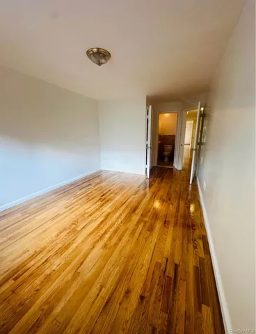 a view of a room with wooden floor and stairs