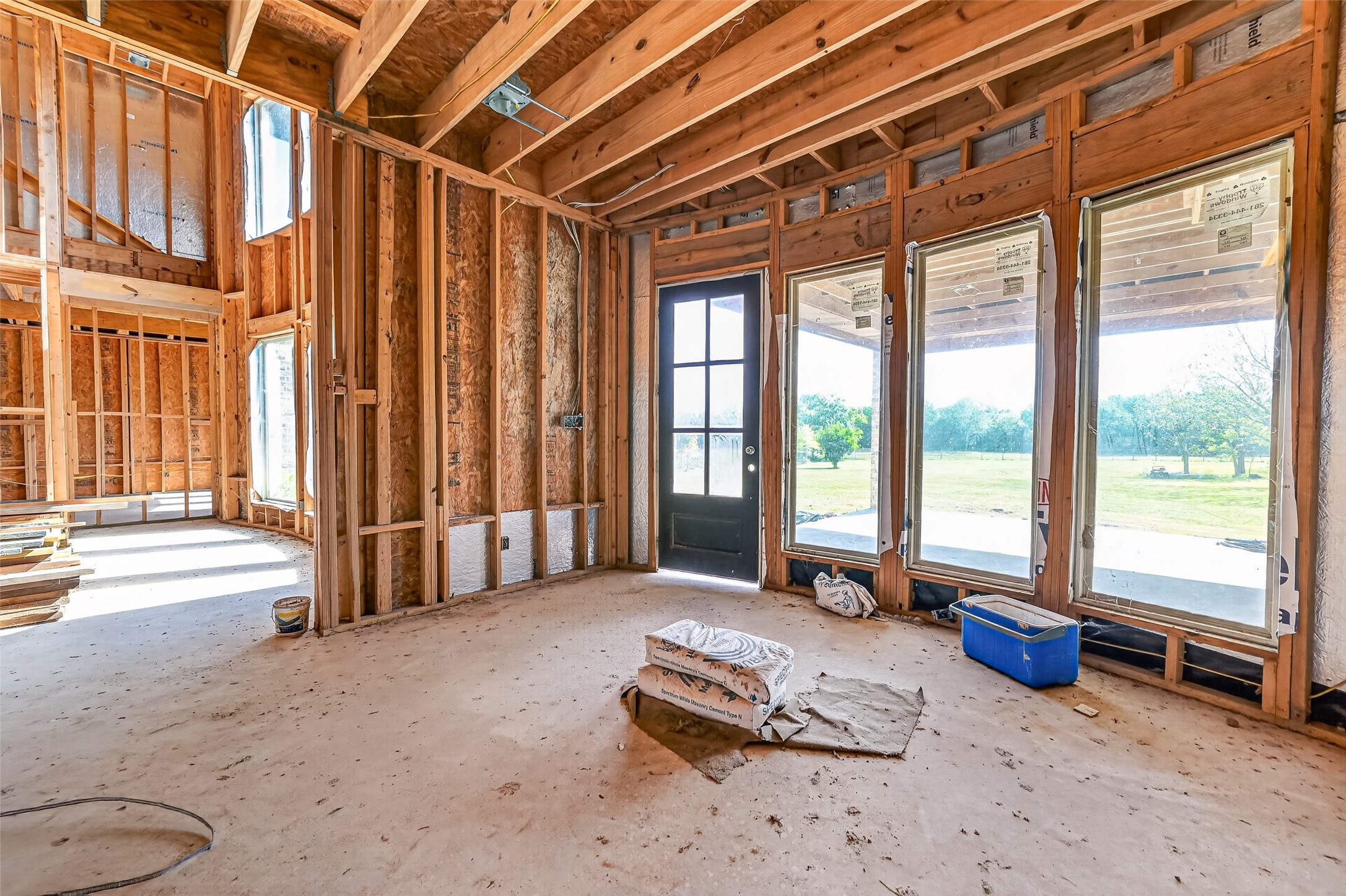 8023 Pool Hill Road Fulshear, TX 77441 - Photo 19 of 50 a bedroom with furniture and large windows