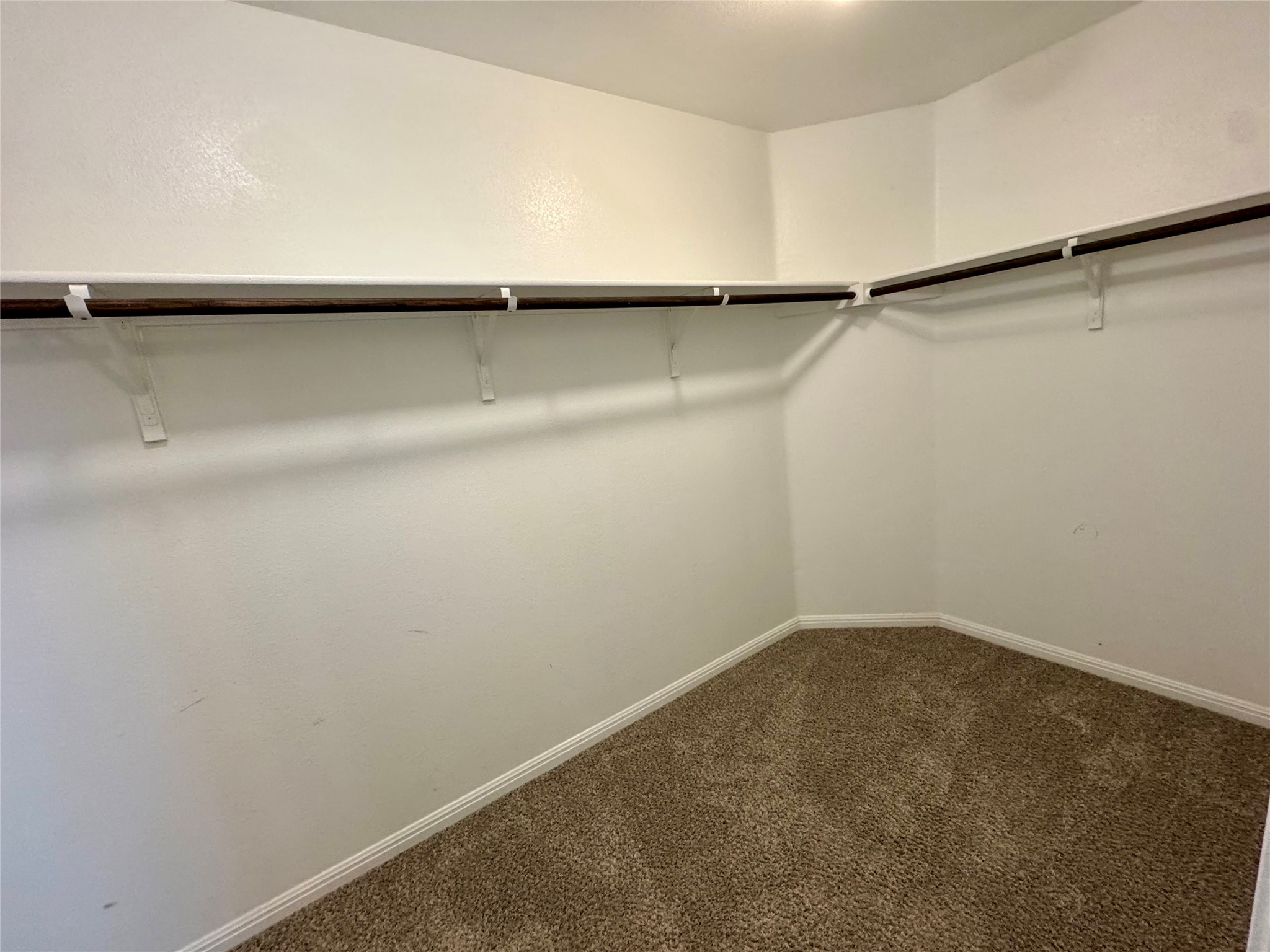 219 Wapiti Road Buda, TX 78610 - Photo 16 of 24 a view of a room with racks on the wall