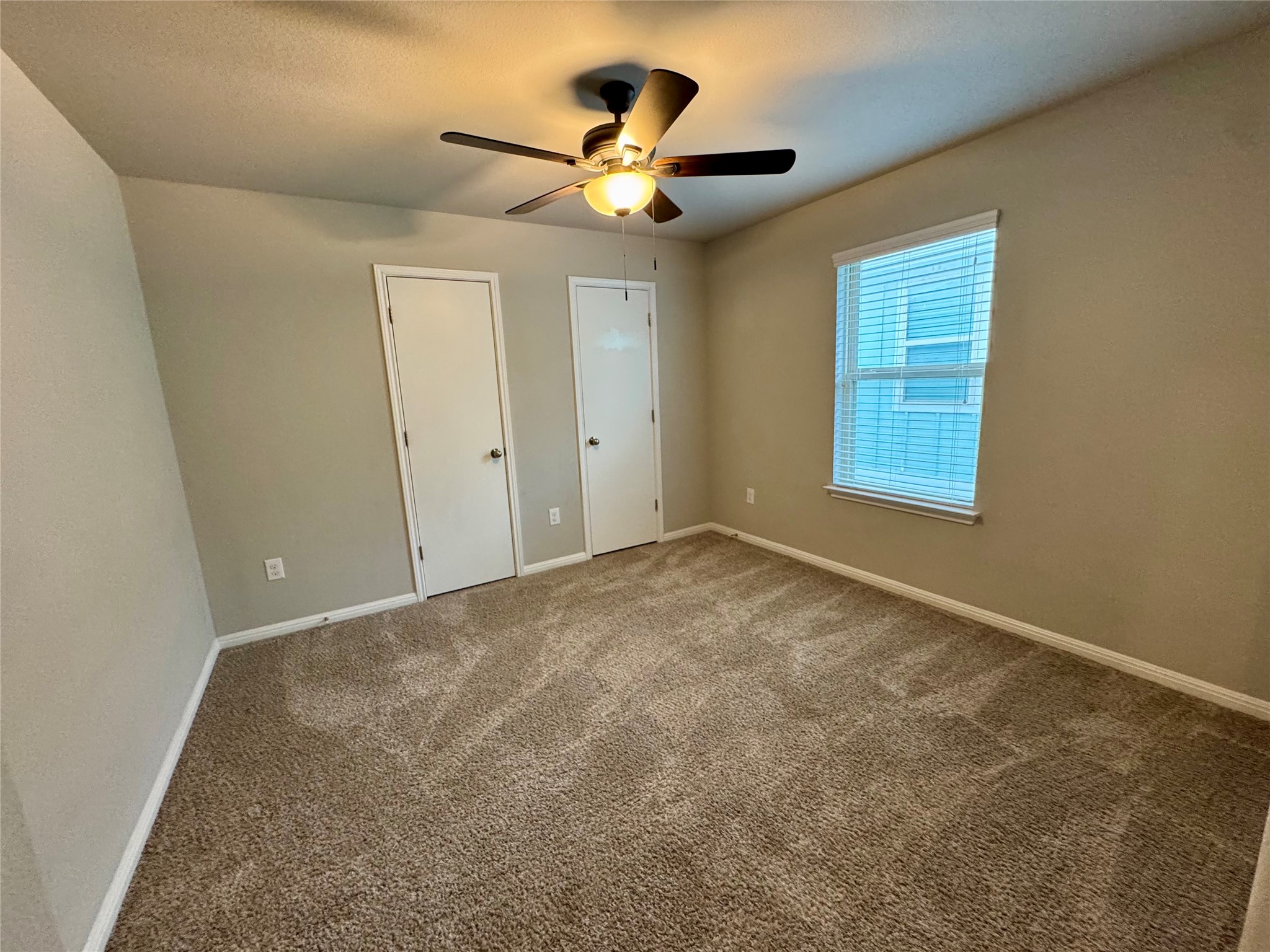 219 Wapiti Road Buda, TX 78610 - Photo 19 of 24 a view of an empty room with a window