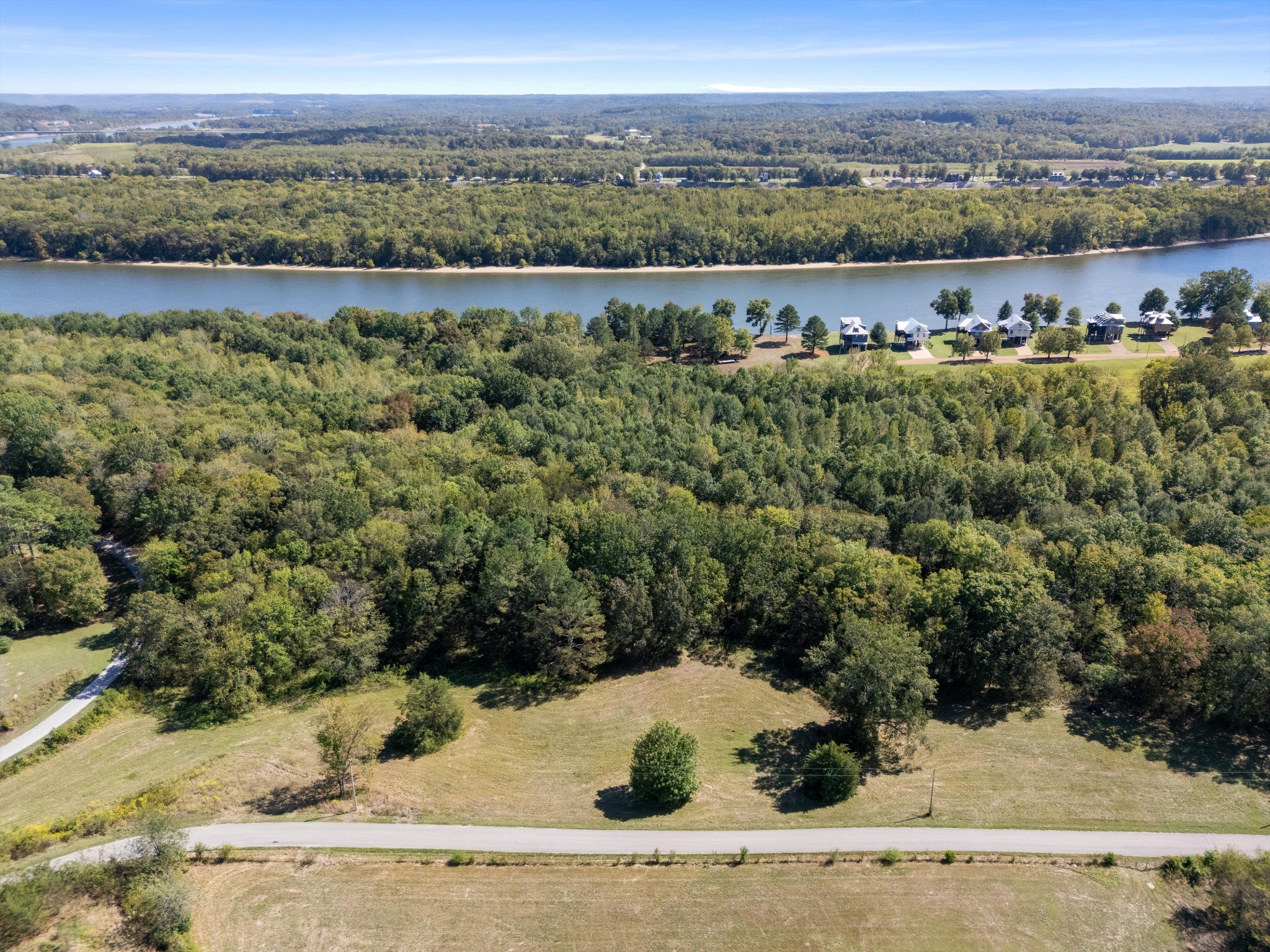 0 Martin Landing Road Bath Springs, TN 38311 - Photo 4 of 14 an aerial view of a houses with a yard and lake view