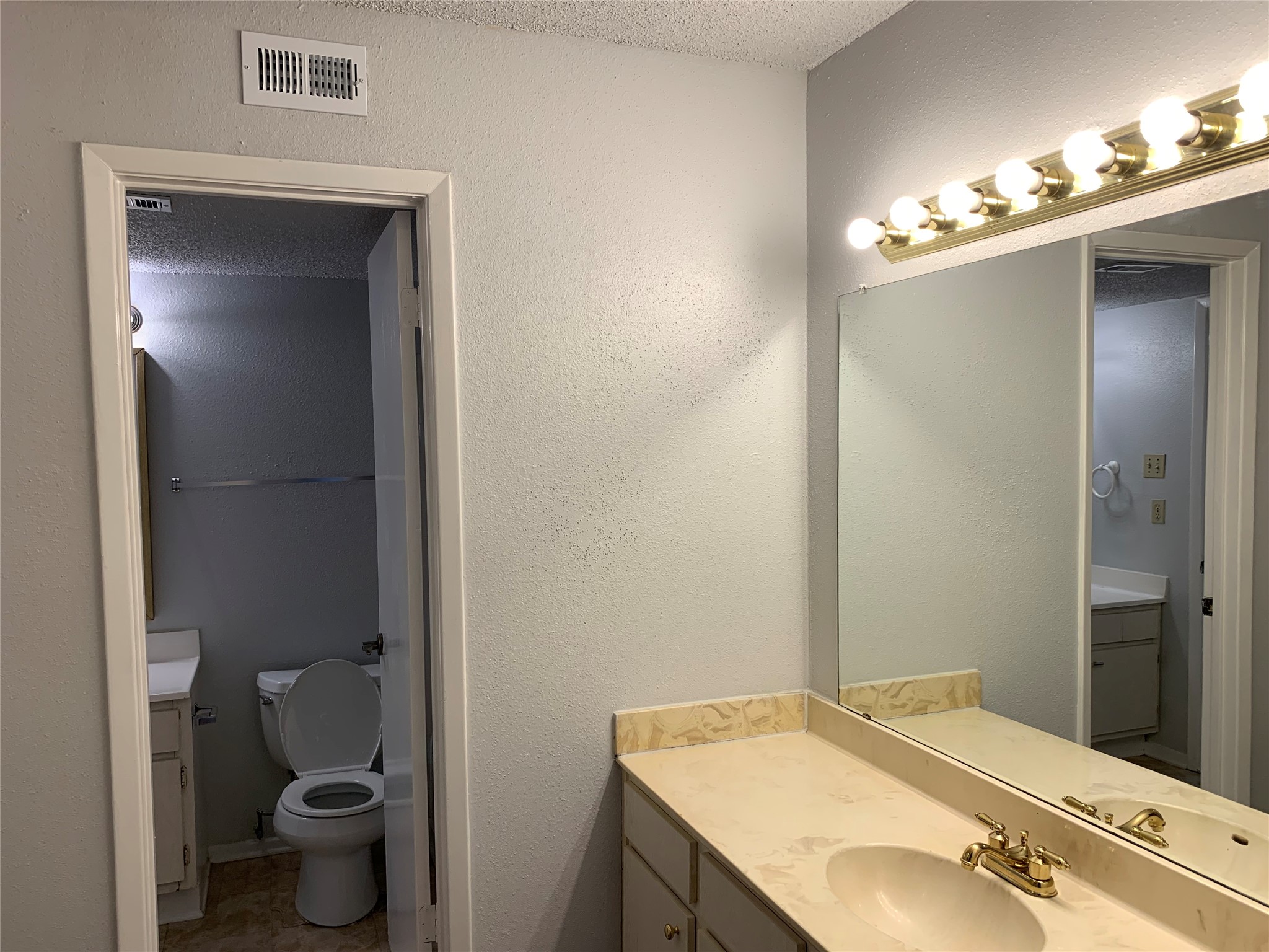 13002 Leader Street, Unit 1/904 Houston, TX 77072 - Photo 7 of 14 2 vanities, one connected with the primary bedroom