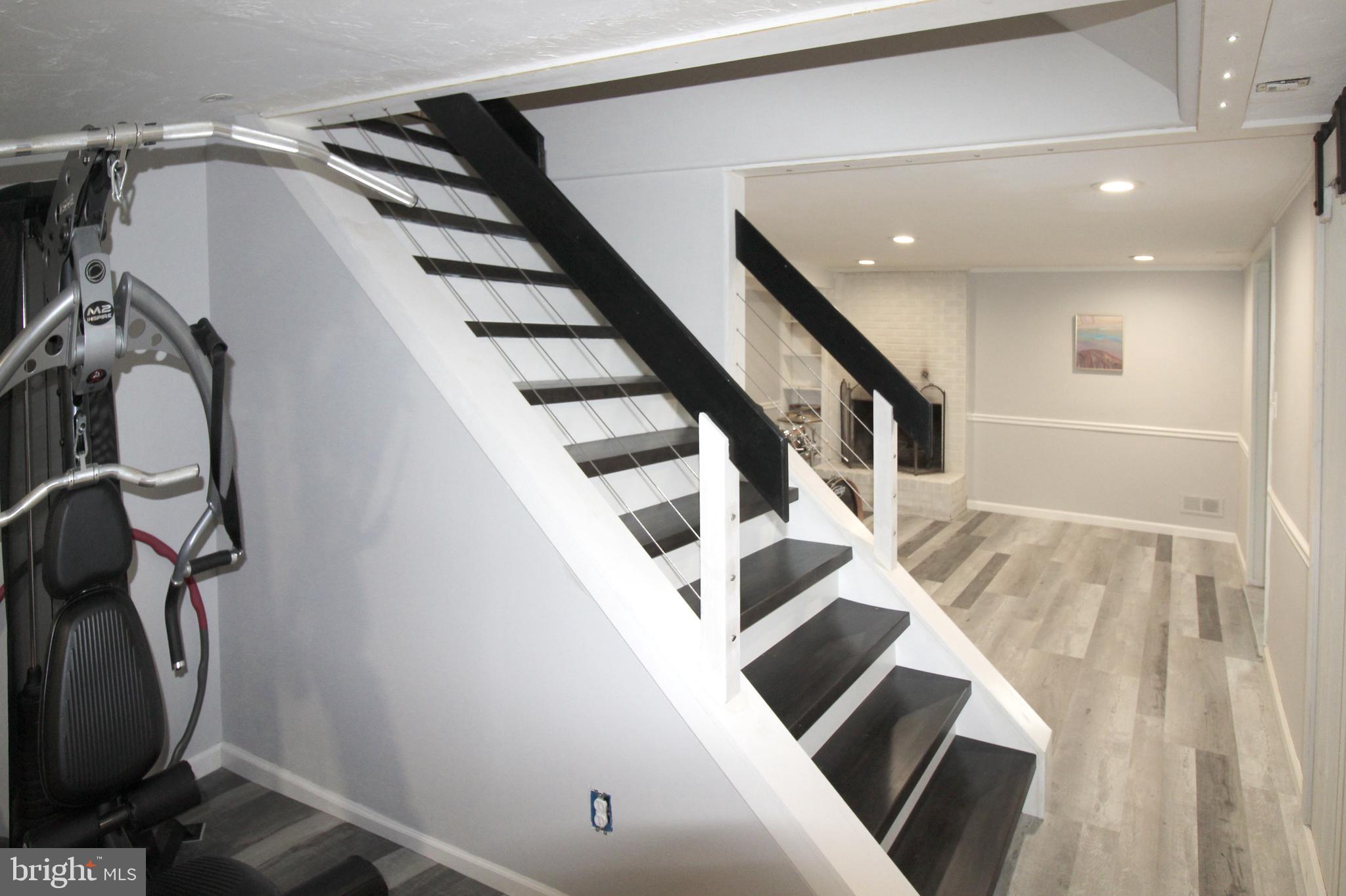 5678 Waterloo Road Columbia, MD 21045 - Photo 21 of 24 Custom stair case with stainless cable rail