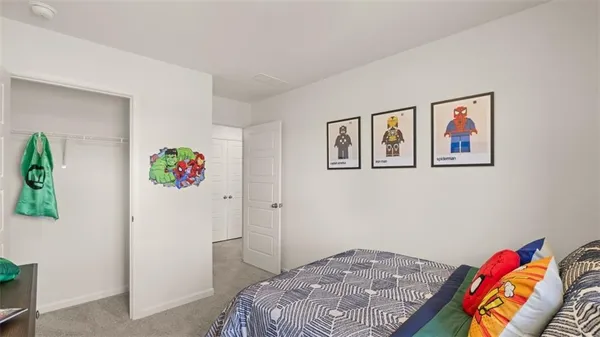 a bedroom with a bed and hallway