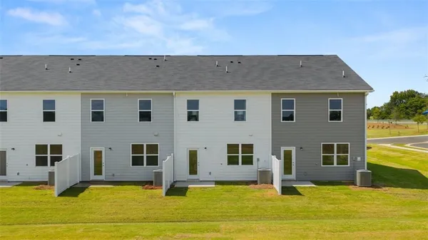 a view of house with yard