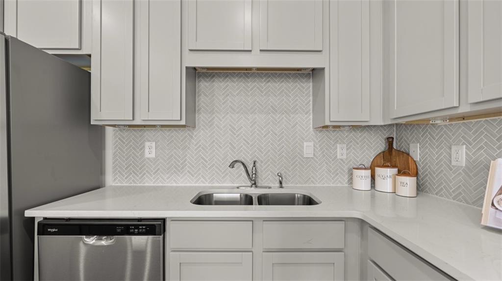 202 Kenmore Circle Perry, GA 31069 - Photo 9 of 47 a kitchen with a sink cabinets and appliances