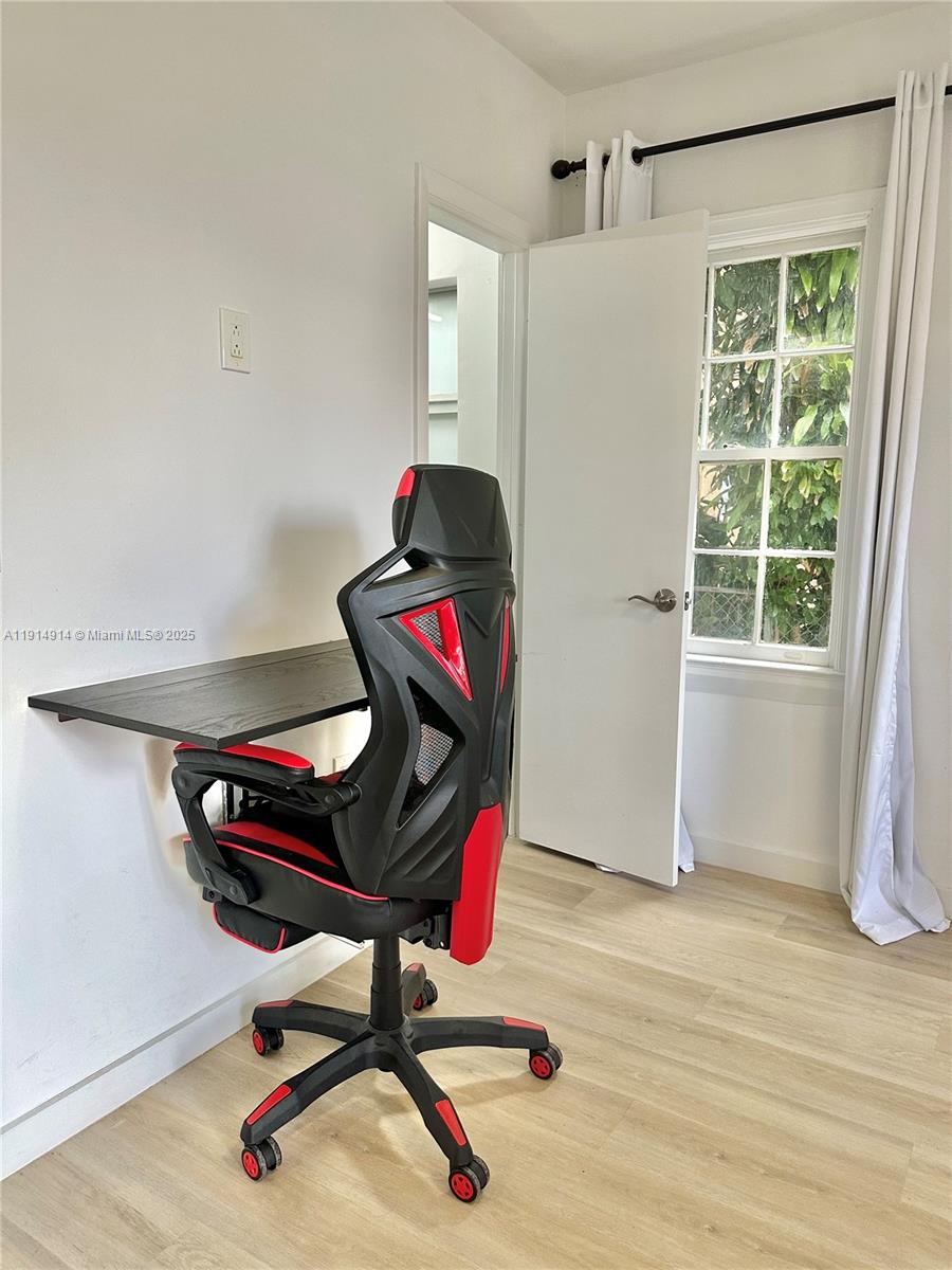 415 75th Street, Unit 1A Miami Beach, FL 33141 - Photo 7 of 19 a view of workspace with furniture and windows