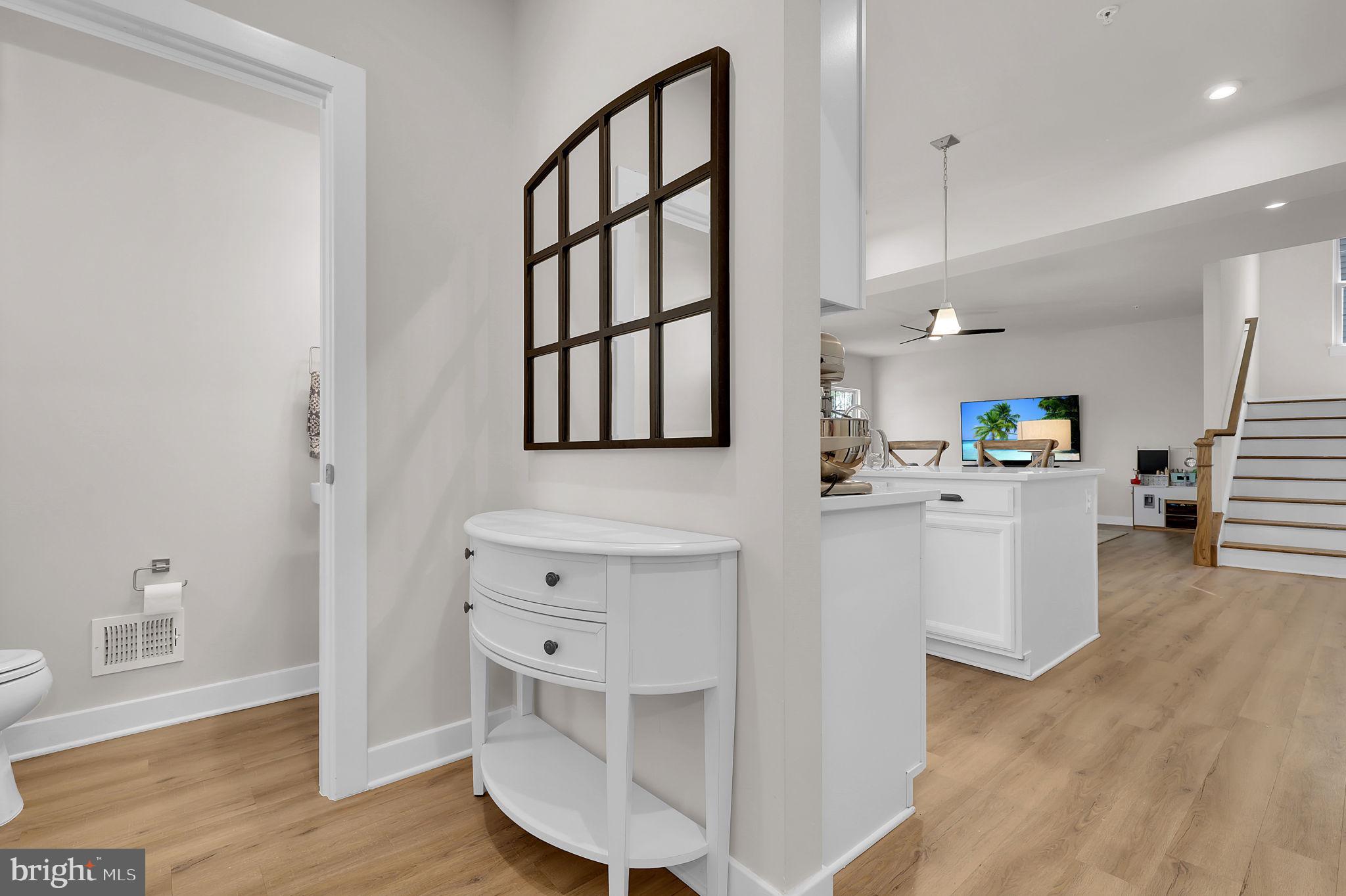 6919 Eaglehead Drive New Market, MD 21774 - Photo 14 of 59 a kitchen with cabinets and wooden floor