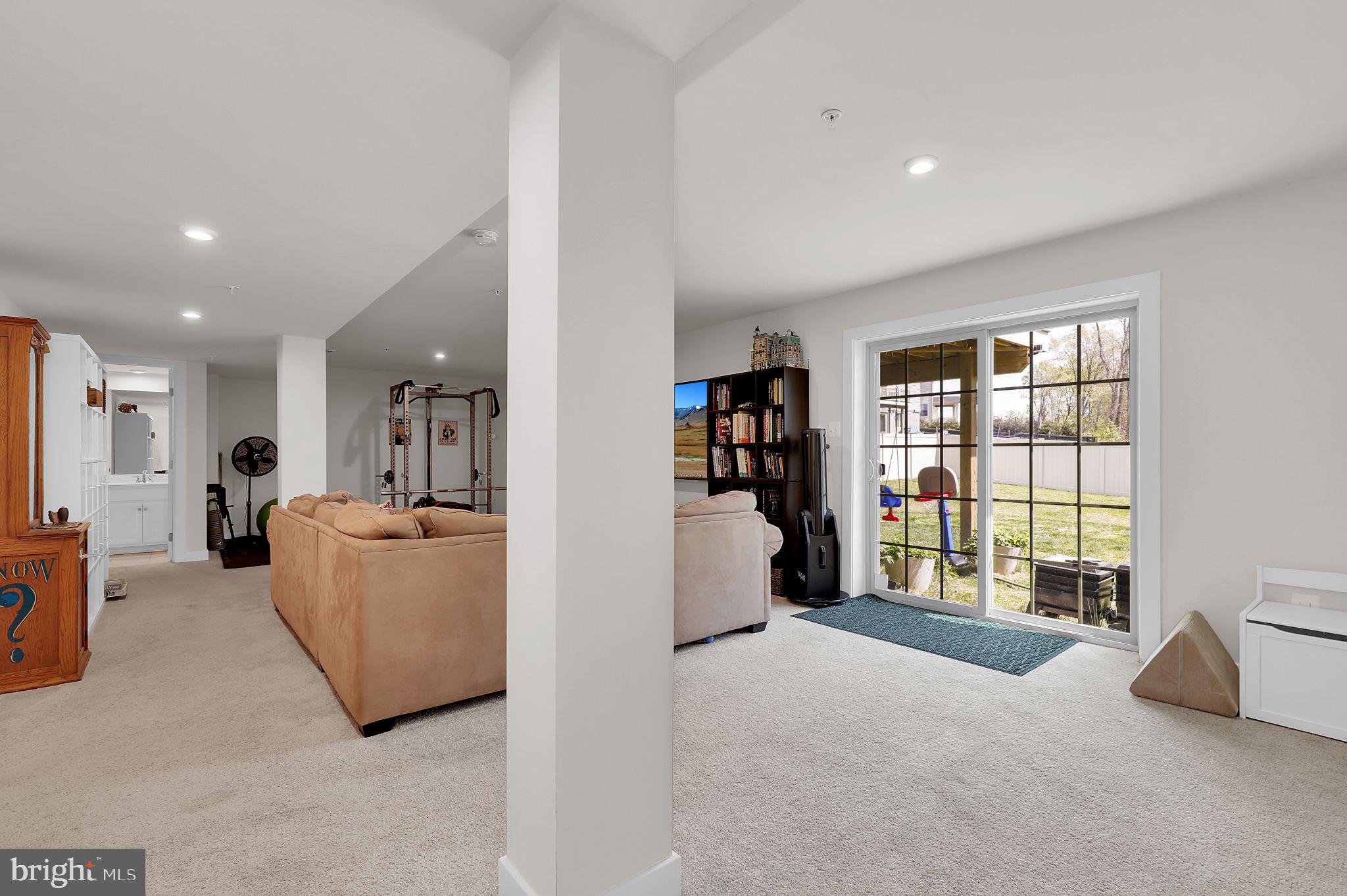 6919 Eaglehead Drive New Market, MD 21774 - Photo 30 of 59 a living room with furniture and a window