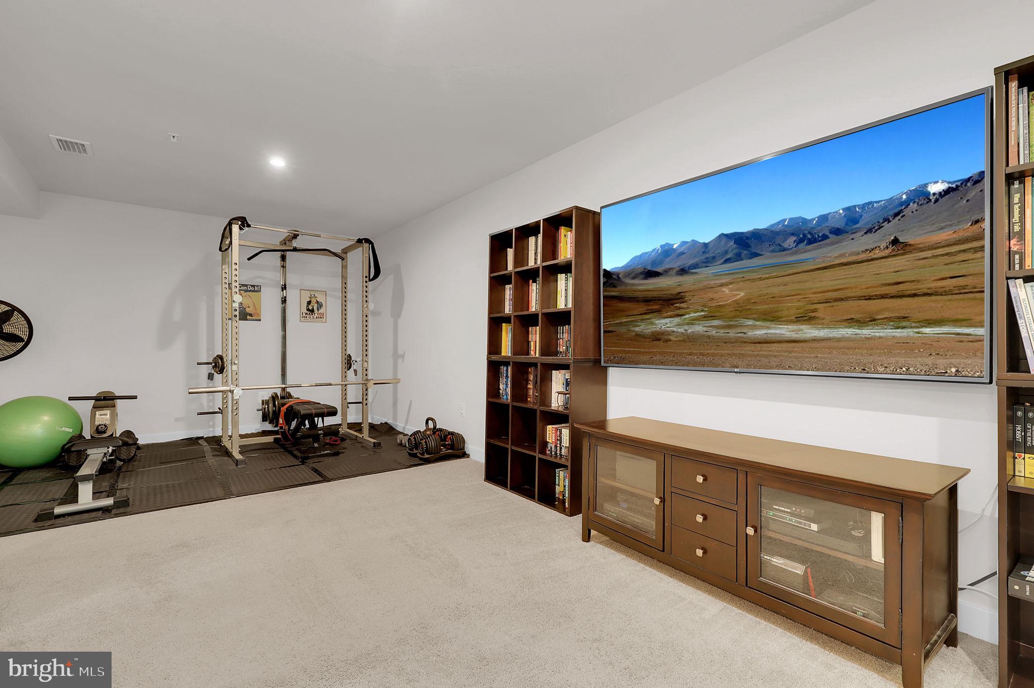 6919 Eaglehead Drive New Market, MD 21774 - Photo 33 of 59 a bed room with a bed and a television