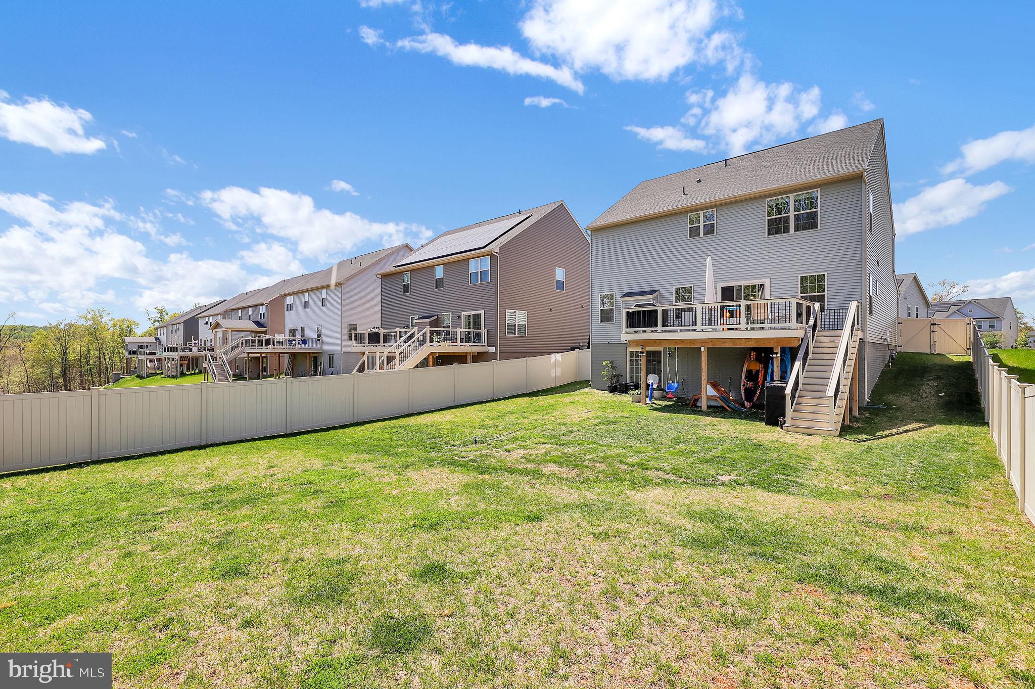 6919 Eaglehead Drive New Market, MD 21774 - Photo 39 of 59 a view of a house with a yard and sitting area
