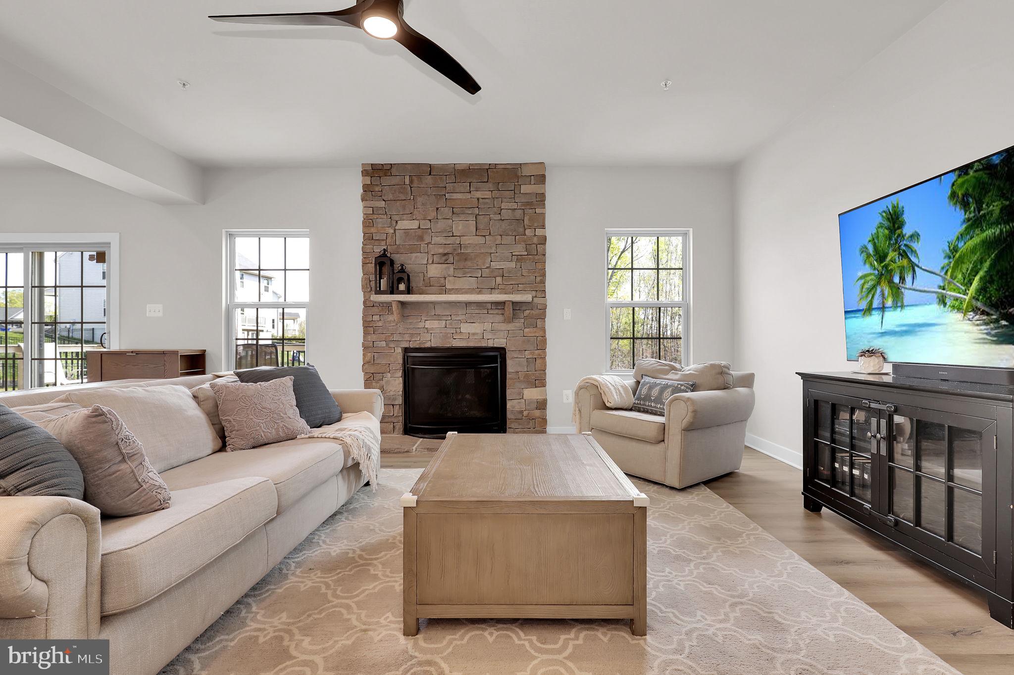 6919 Eaglehead Drive New Market, MD 21774 - Photo 6 of 59 a living room with furniture and a fireplace