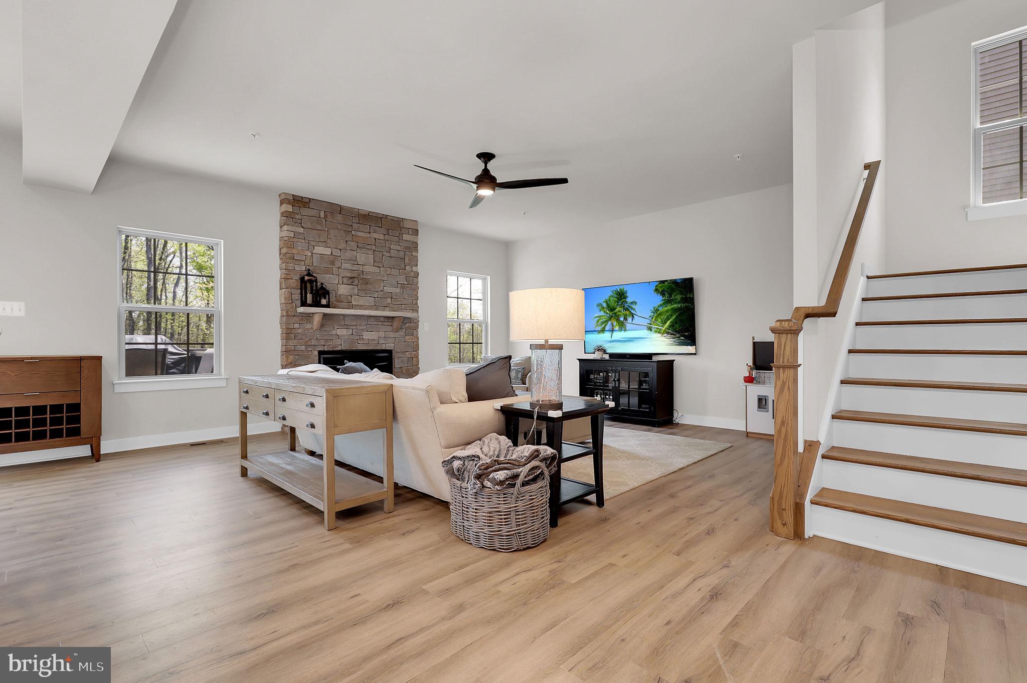 6919 Eaglehead Drive New Market, MD 21774 - Photo 7 of 59 a living room with furniture and a wooden floor