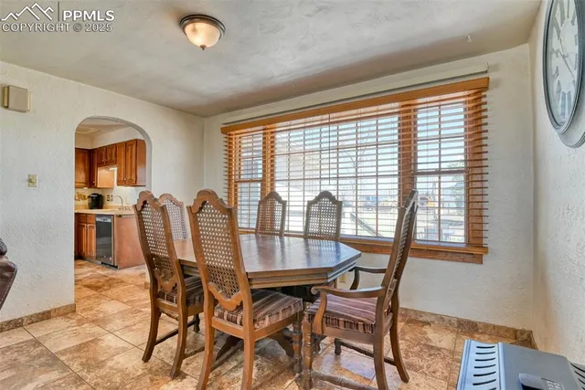 a view of kitchen and dining room with furniture