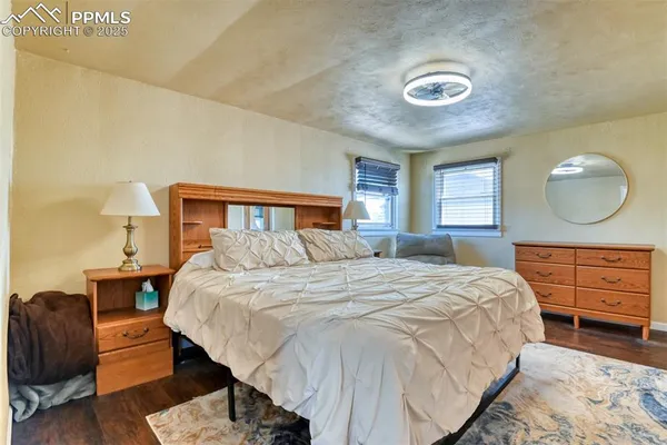 a bedroom with a bed and couch