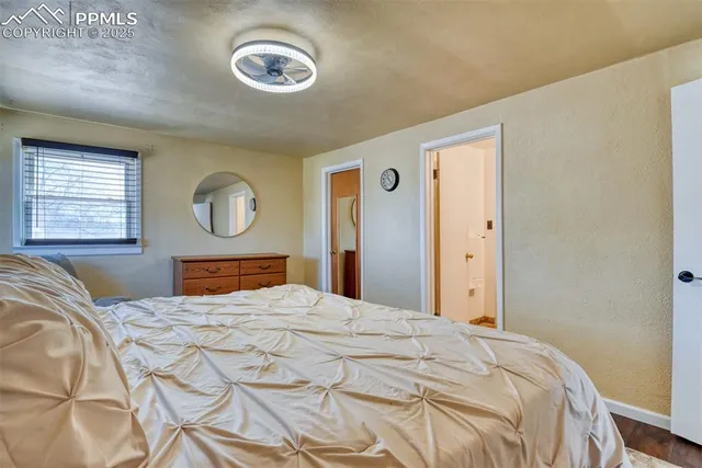 a bedroom with a bed and a view of bathroom