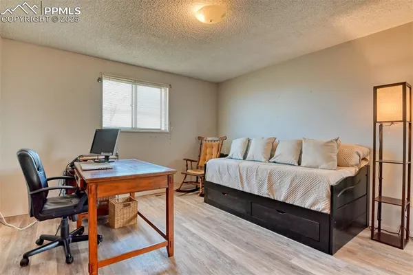 a bedroom with a bed and furniture