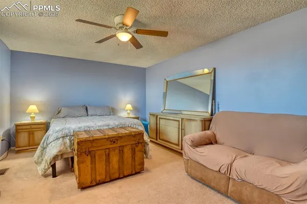 a room with a bed and furniture