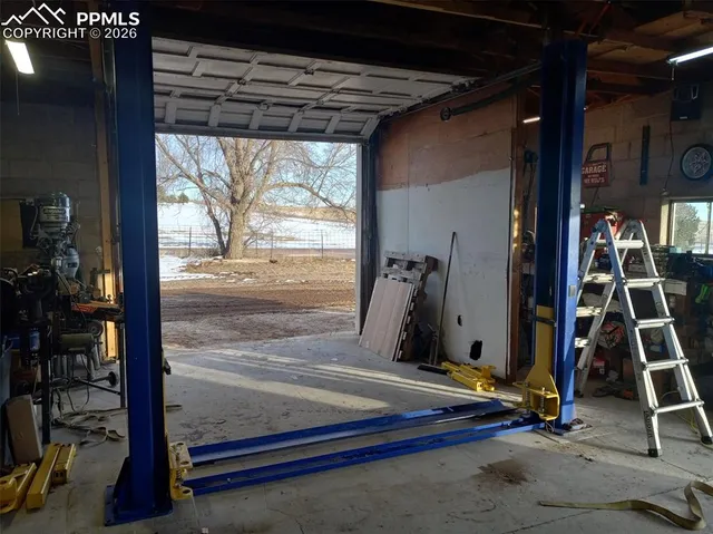 a view of an empty room with windows