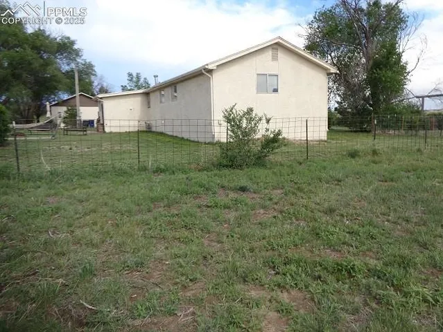 a backyard of a house with lots of green space