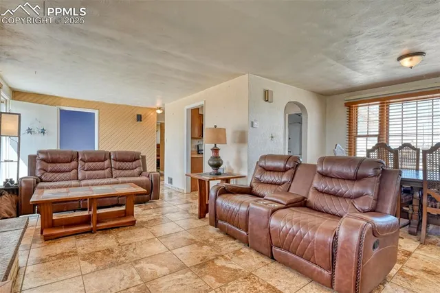 a view of a dining room with furniture and window