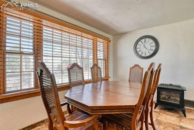 a living room with furniture fireplace and a fireplace
