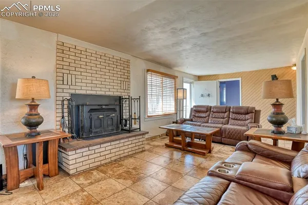 a view of a dining room with furniture and a flat screen tv