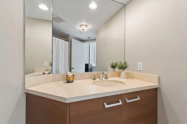 a bathroom with a sink and a mirror