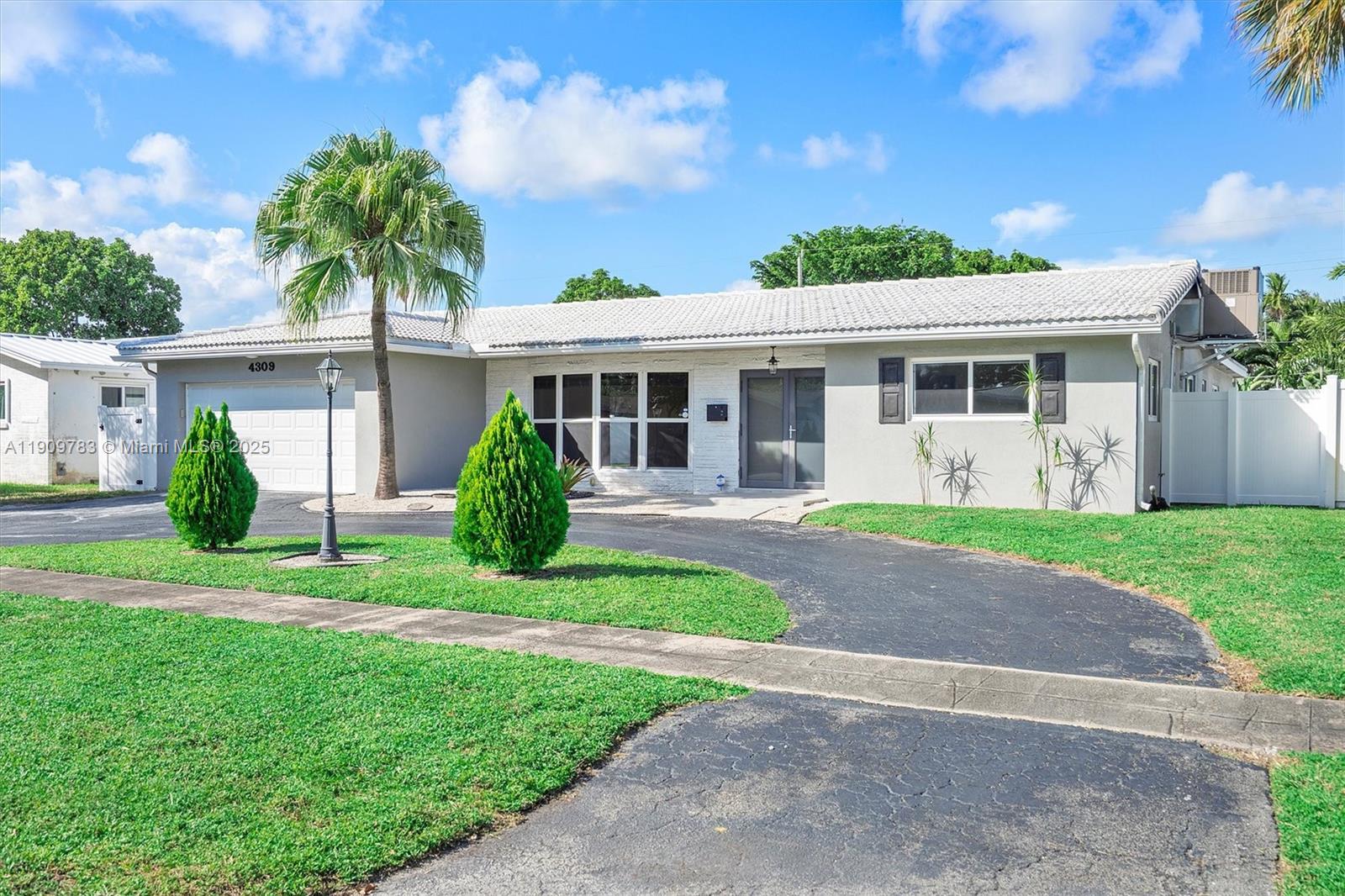 4309 Jackson Street Hollywood, FL 33021 - Photo 1 of 39 a view of a house with a yard