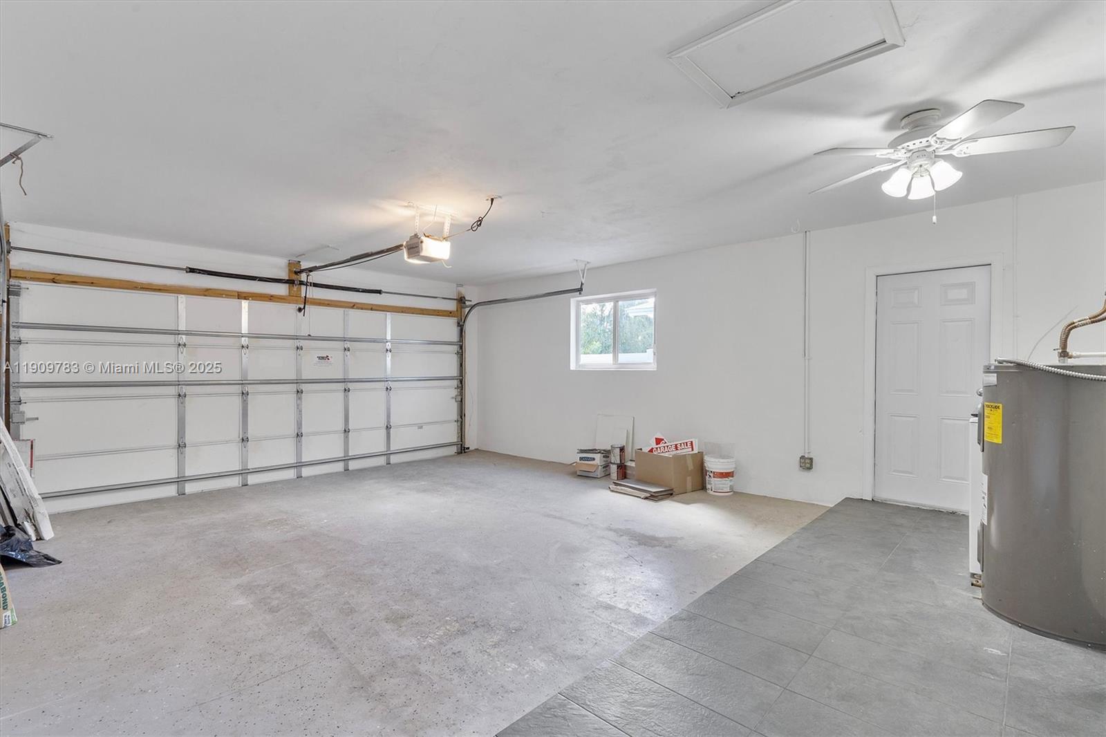 4309 Jackson Street Hollywood, FL 33021 - Photo 17 of 39 a view of a livingroom with glass windows and chandelier fan