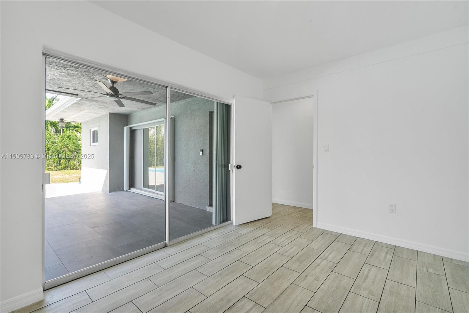 4309 Jackson Street Hollywood, FL 33021 - Photo 24 of 39 a view of a big room with windows and chandelier fan
