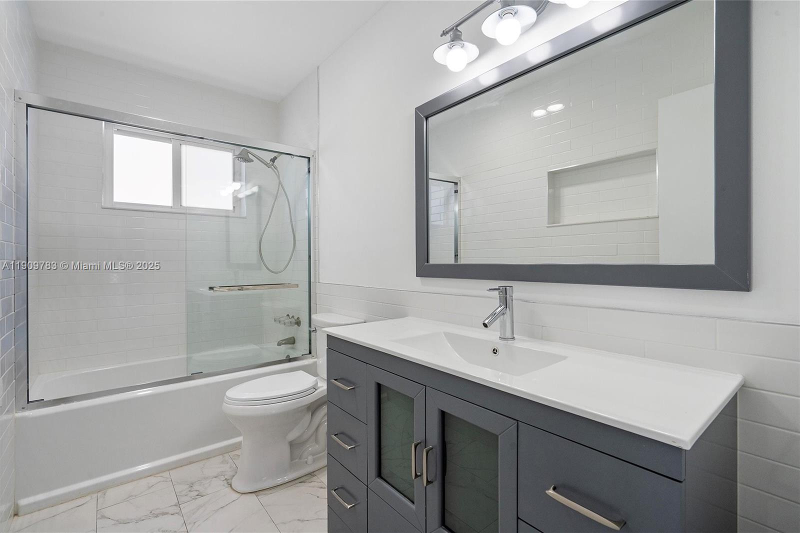 4309 Jackson Street Hollywood, FL 33021 - Photo 26 of 39 a bathroom with a sink toilet and shower