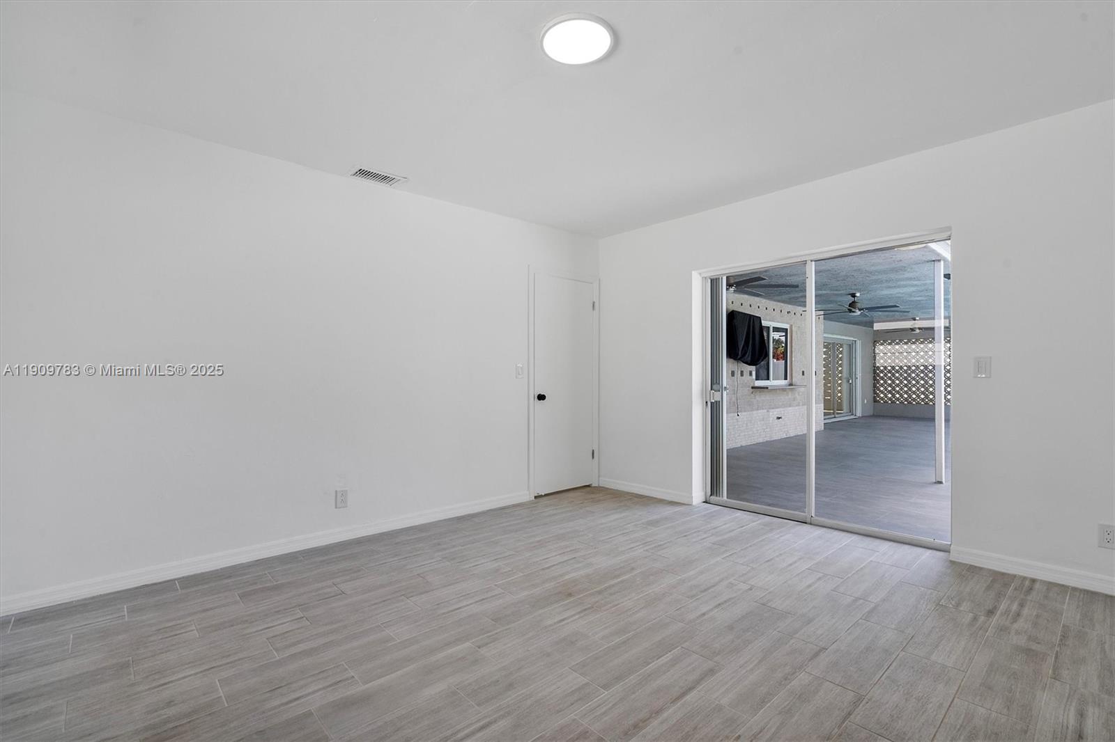 4309 Jackson Street Hollywood, FL 33021 - Photo 29 of 39 a view of empty room with wooden floor