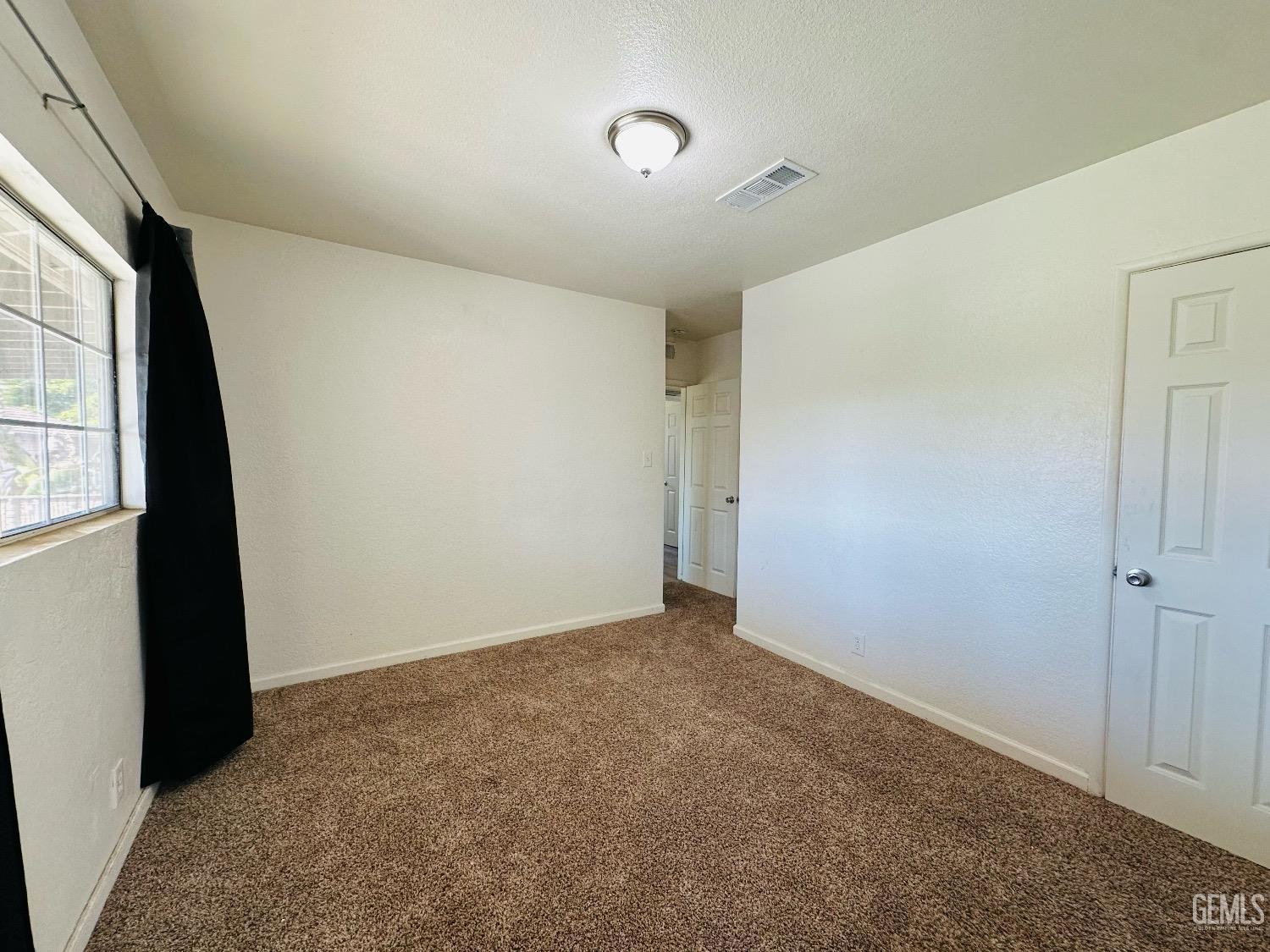 Undisclosed Address Bakersfield, CA 93304 - Photo 18 of 26 a view of an empty room