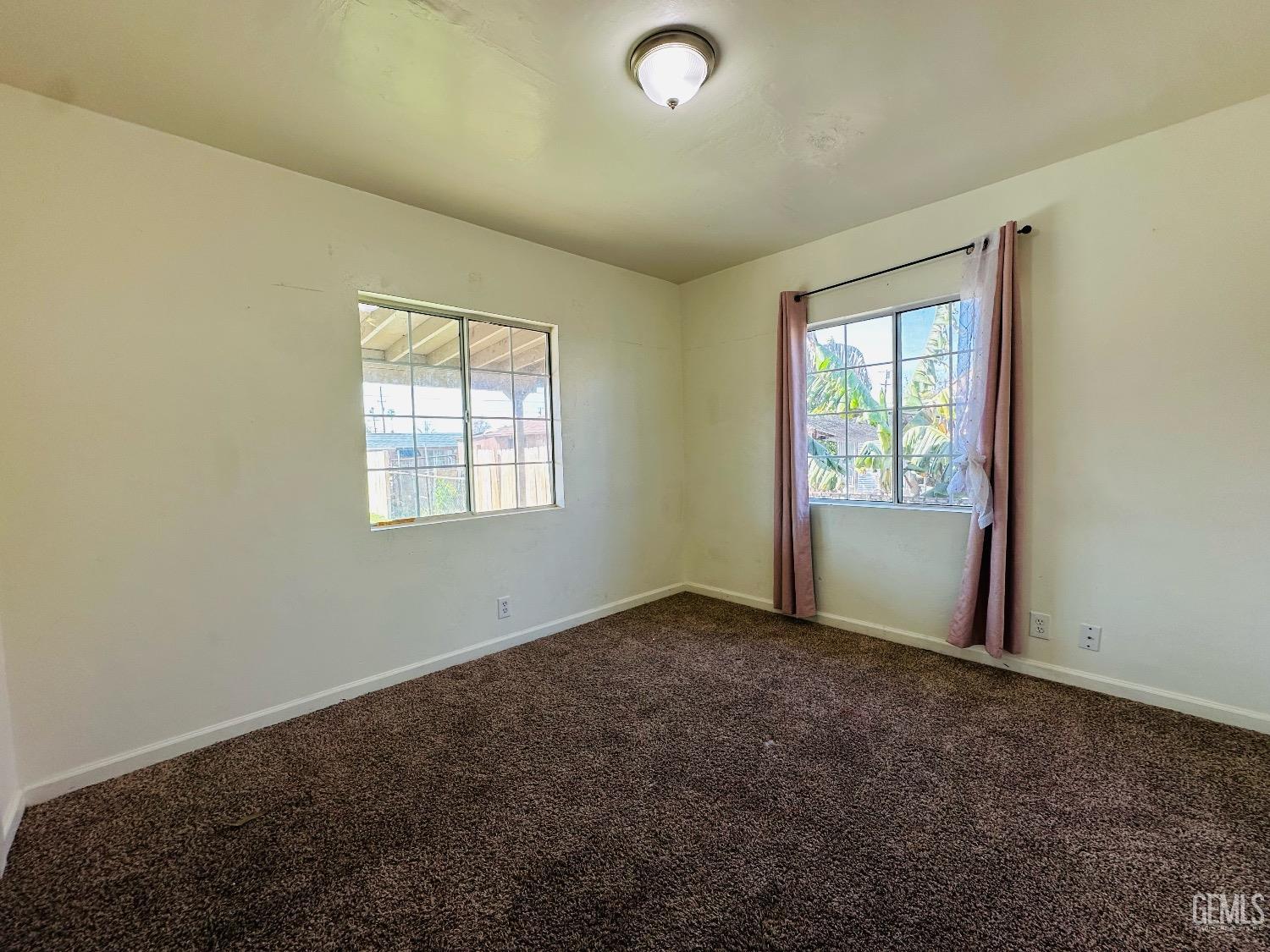 Undisclosed Address Bakersfield, CA 93304 - Photo 20 of 26 an empty room with windows