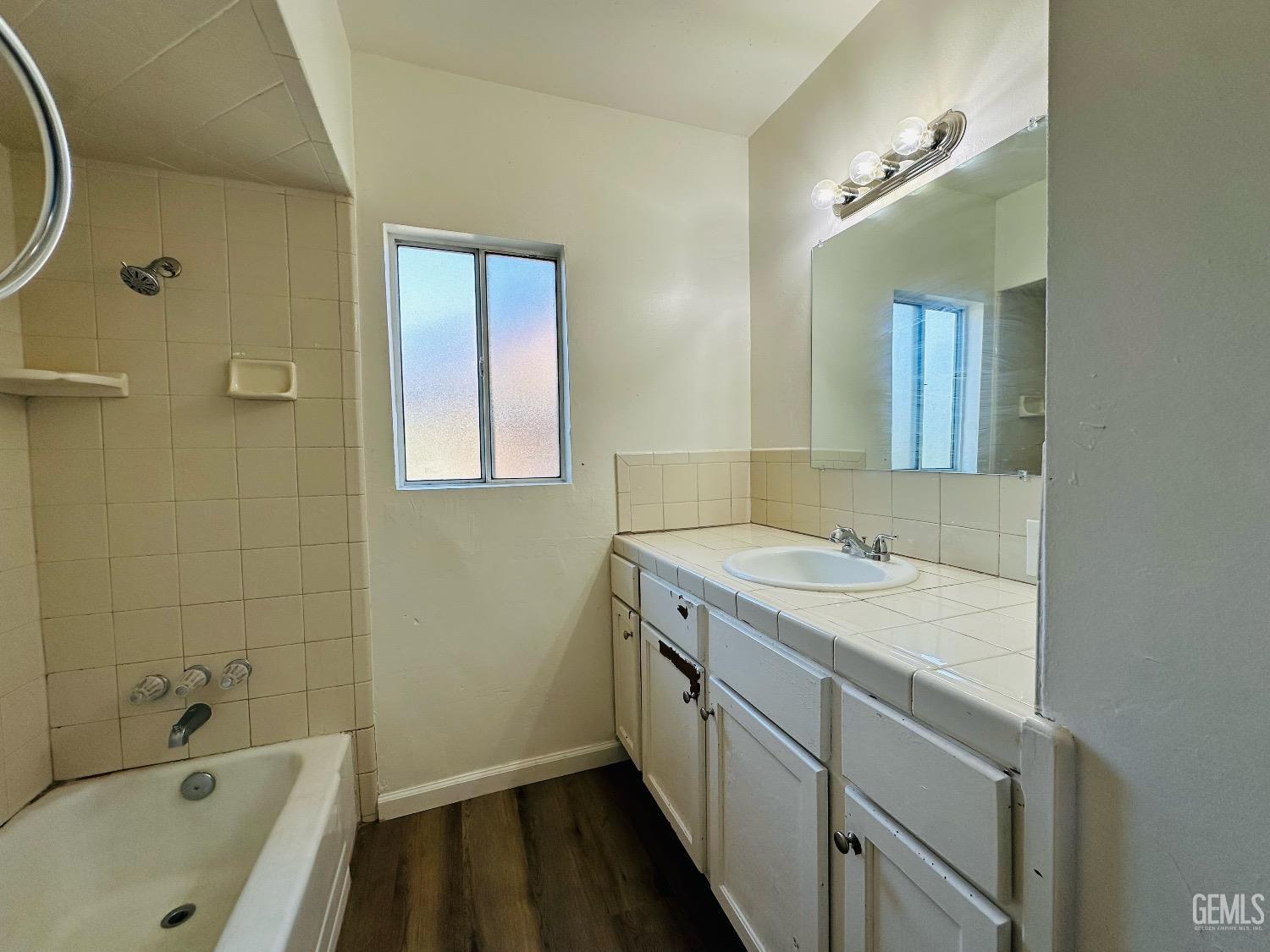 Undisclosed Address Bakersfield, CA 93304 - Photo 23 of 26 a bathroom with a sink and a bathtub