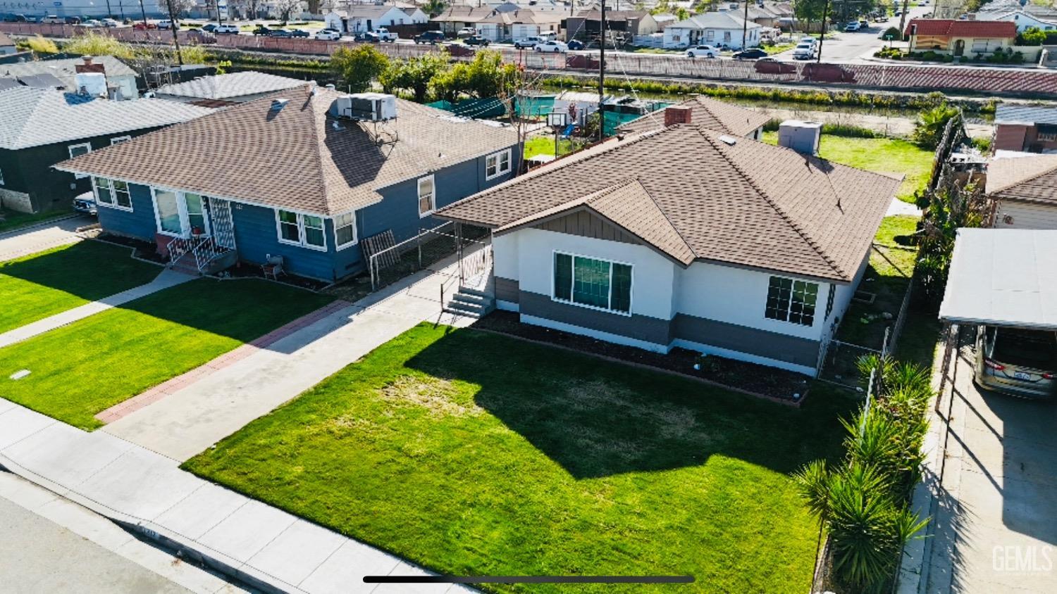 Undisclosed Address Bakersfield, CA 93304 - Photo 3 of 26 a aerial view of a house with swimming pool yard and outdoor seating