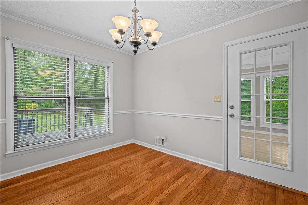 1267 Austin Bridge Road Douglasville, GA 30134 - Photo 12 of 66 a view of empty room with wooden floor and fan