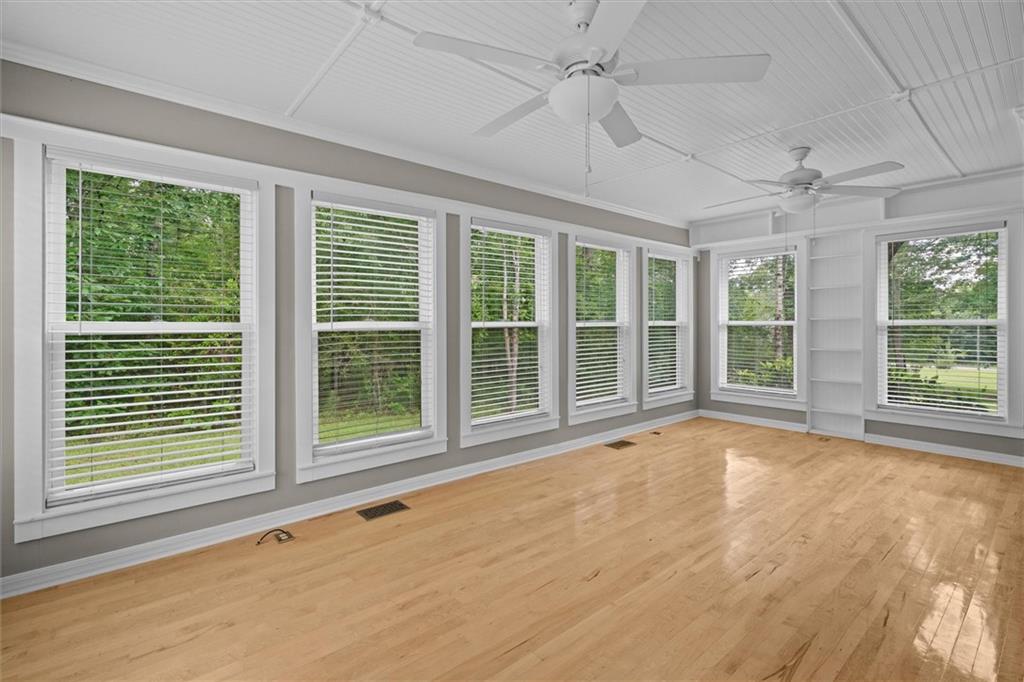 1267 Austin Bridge Road Douglasville, GA 30134 - Photo 13 of 66 a view of an empty room with a window and a fireplace