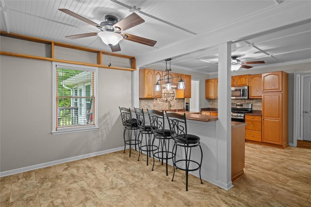 1267 Austin Bridge Road Douglasville, GA 30134 - Photo 20 of 66 a view of a dining room with furniture and a chandelier