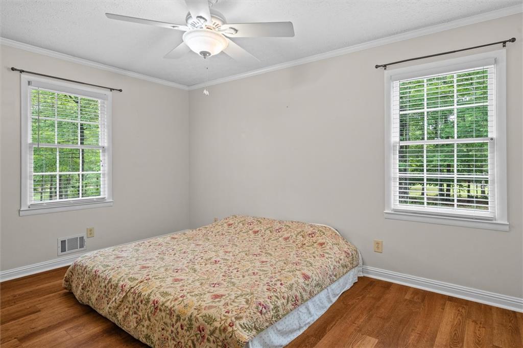 1267 Austin Bridge Road Douglasville, GA 30134 - Photo 22 of 66 a bedroom with a bed and a window