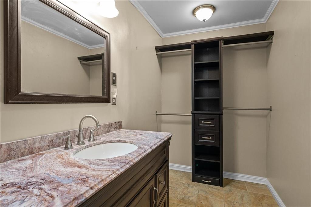 1267 Austin Bridge Road Douglasville, GA 30134 - Photo 25 of 66 a bathroom with a granite countertop sink and a mirror