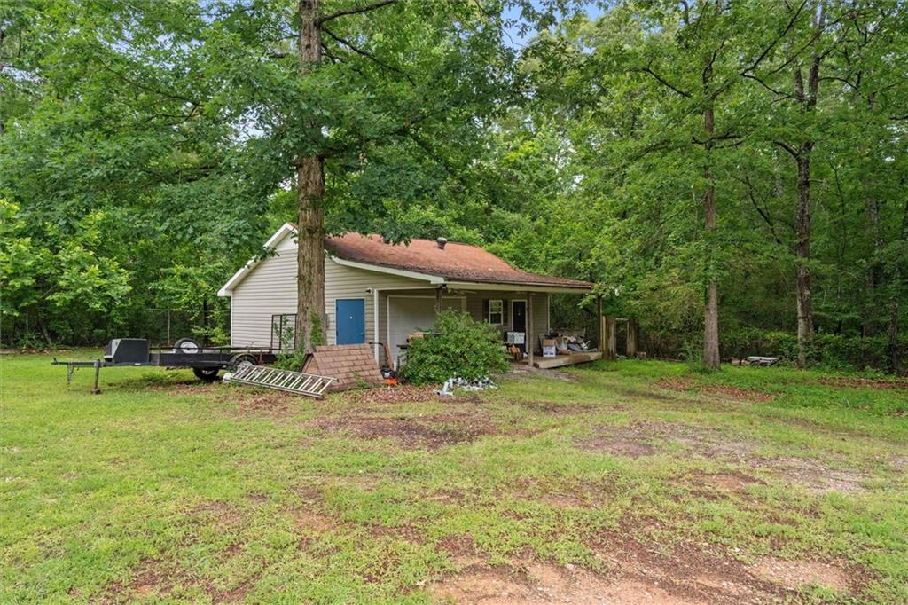 1267 Austin Bridge Road Douglasville, GA 30134 - Photo 35 of 66 a view of a house with a yard