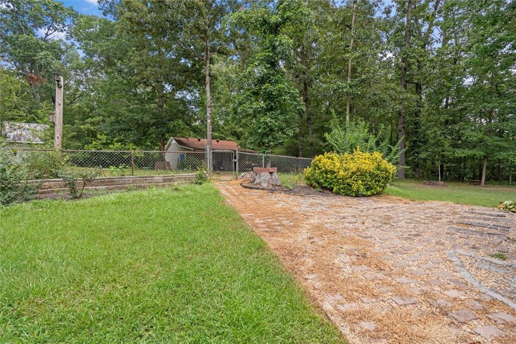 1267 Austin Bridge Road Douglasville, GA 30134 - Photo 47 of 66 a house view with a garden space