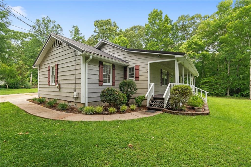 1267 Austin Bridge Road Douglasville, GA 30134 - Photo 5 of 66 a view of a house with backyard